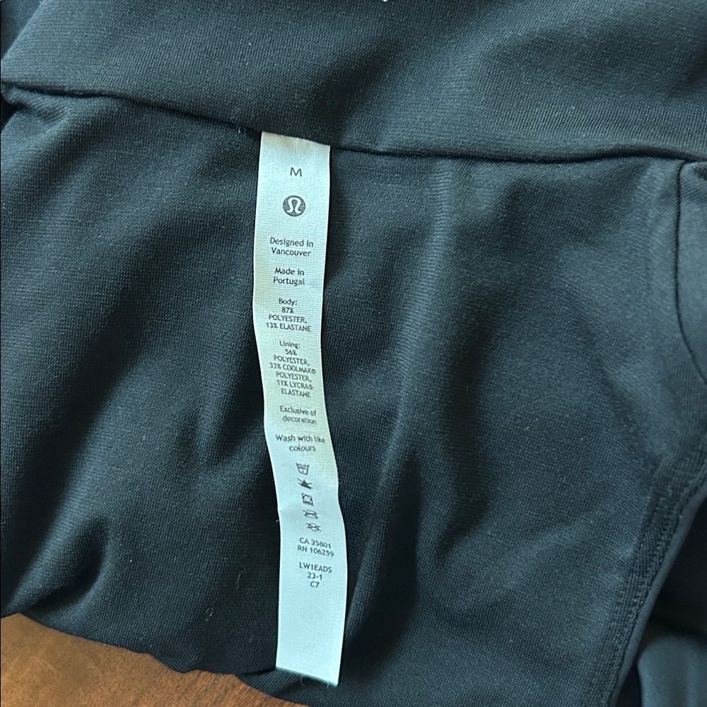 LULULEMON- NWT black tight fit lined half zip tank - Picture 8 of 8